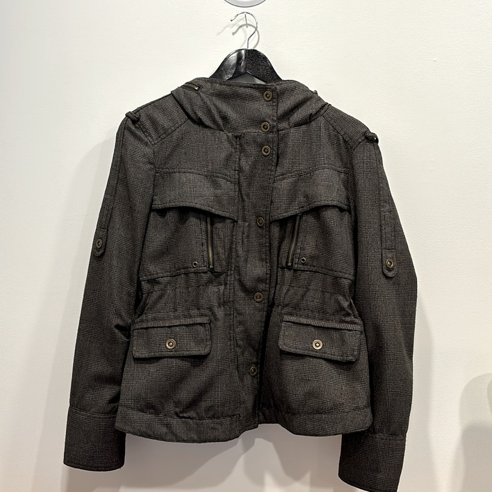 Brown plaid utility jacket with all the snaps and zippers